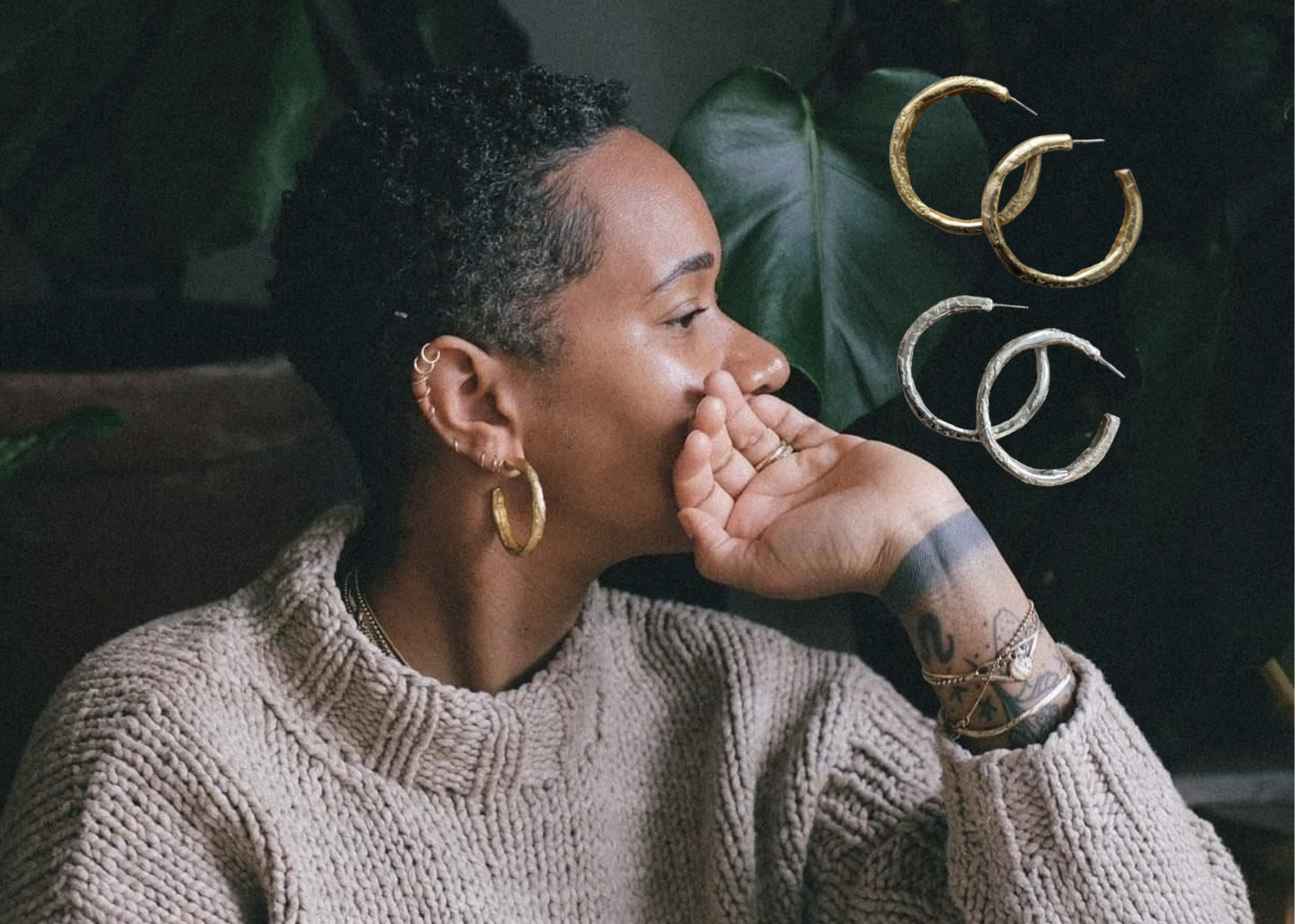 Person wearing a gray sweater and hoop earrings, with two pairs of large hoop earrings displayed beside them.