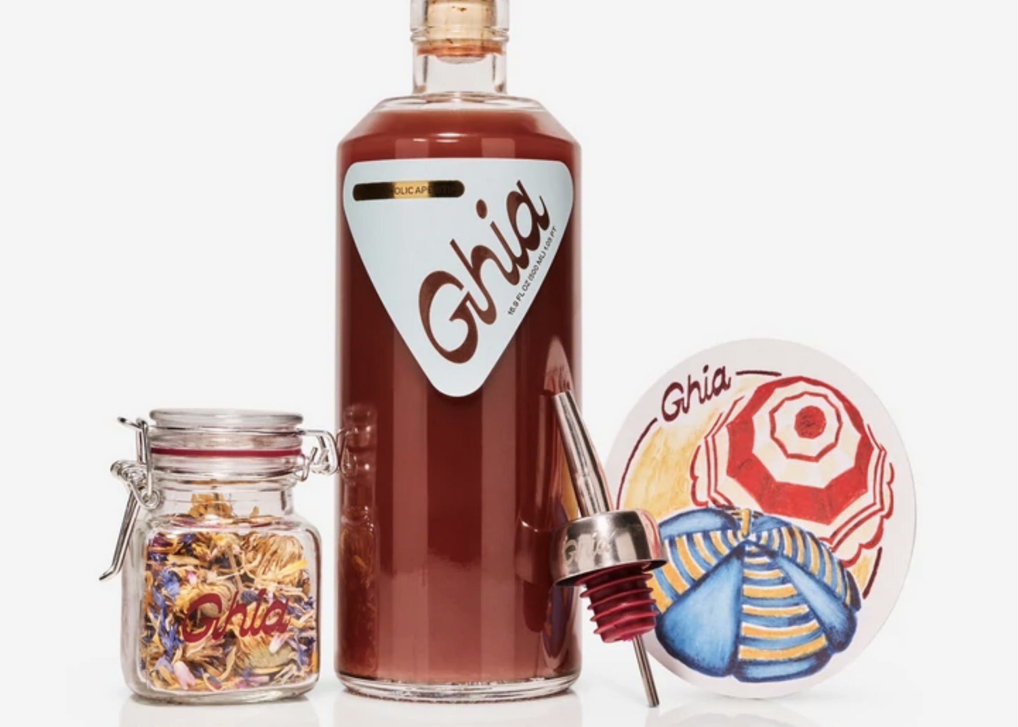 Ghia aperitif bottle, jar of dried ingredients, pour spout, and illustrated coaster