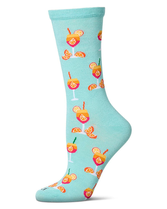Capri breeze crew sock shown from the side, patterned with colorful cocktail glasses, citrus slices, and citrus wedges on a light blue background.