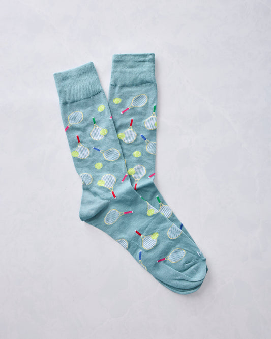 Overlapping blue crew socks with tennis racket and ball print